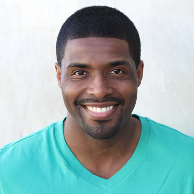 An elderly couple sharing a joyful moment, with the man on the left and the woman on the right.
